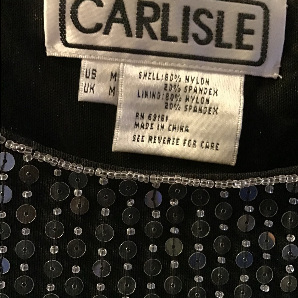 TopBeaded grey and black short sleeve top looks great with grey or black skirt